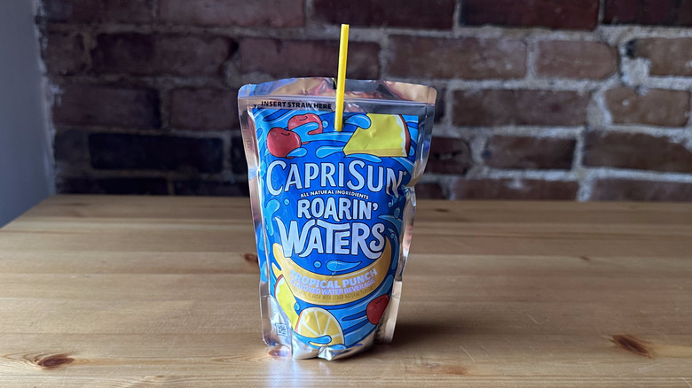 Roarin' Waters tropical punch Capri Sun on wooden table