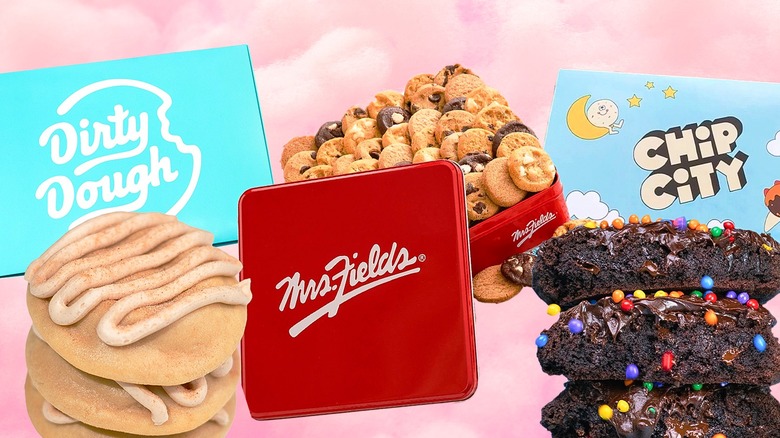 Dirty Dough, Mrs. Fields, and Chip City cookies and containers against a pastel pink background