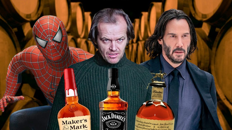 Three people standing in front of whiskey bottles