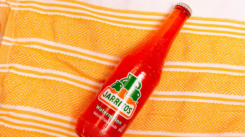 Watermelon Jarritos on beach towl