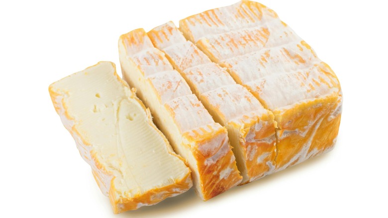 sliced Maroilles on a white background
