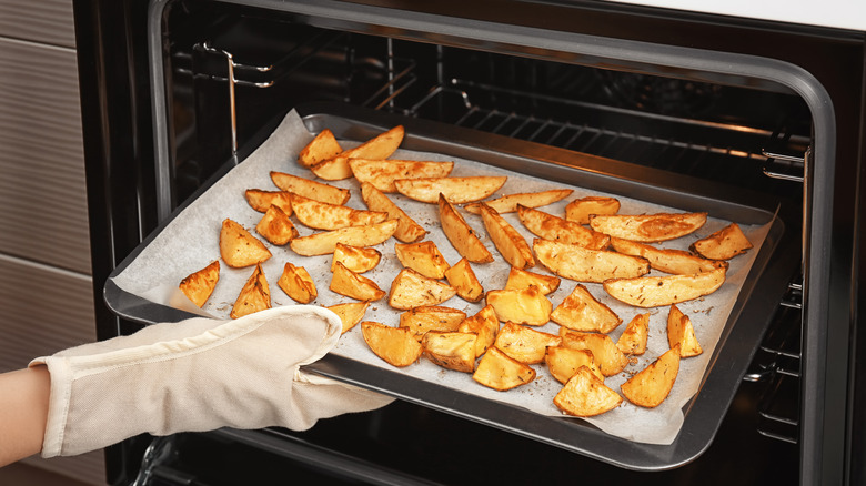 Potato wedges on a baking sheet