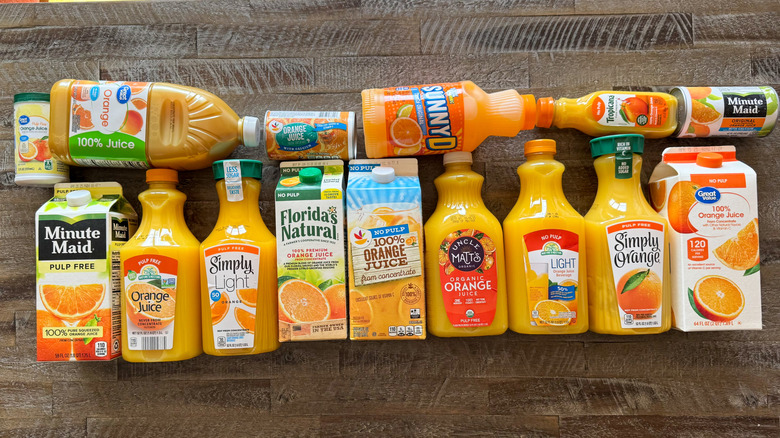 Orange juice brands on wooden countertop