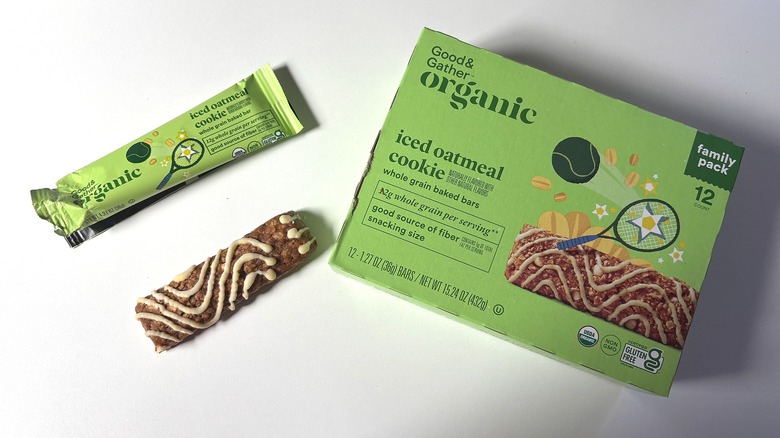 Box of Good & Gather Organic Iced Oatmeal Cookie Bars next to an open bar on a white table