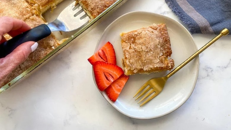 A slice of sopapilla cheesecake on a plate