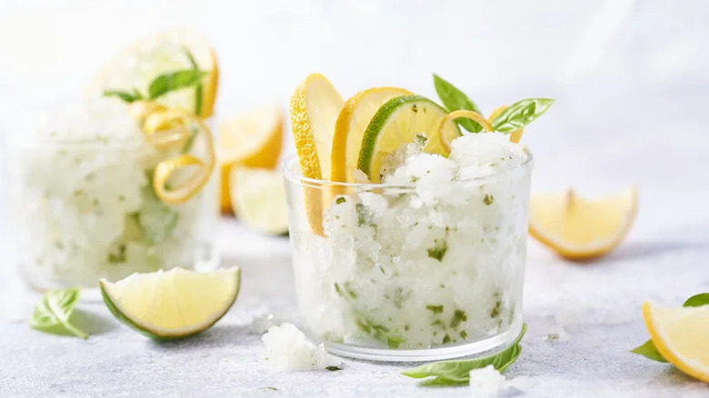 Citrus granita in glass with herbs