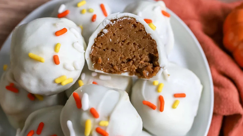 Pumpkin spice truffles with white chocolate and sprinkles