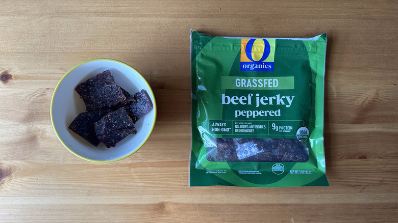 O Organics Grassfed Peppered Beef Jerky on wooden table
