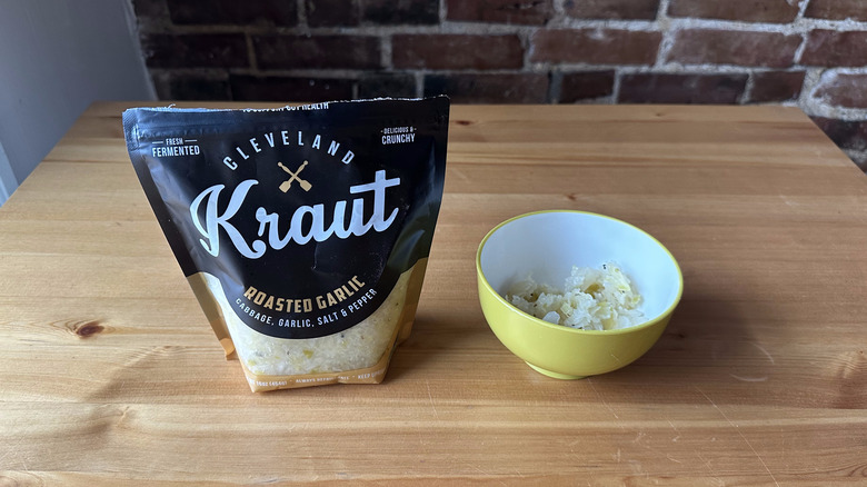 Cleveland Kraut Roasted Garlic on wooden table and in bowl
