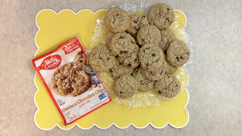 Betty Crocker oatmeal chocolate chip cookies on clear platter on yellow placemat
