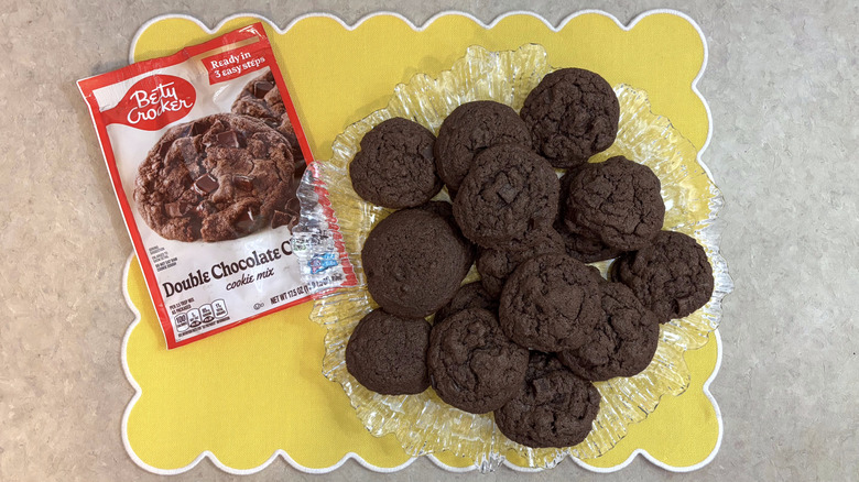Betty Crocker double chocolate chunk cookies on clear platter on yellow placemat
