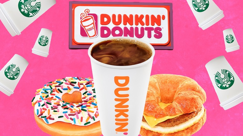 Cup of Dunkin' coffee in front of a donut, breakfast sandwich, the Dunkin' Donuts logo, and to-go Starbucks cups on a pink background