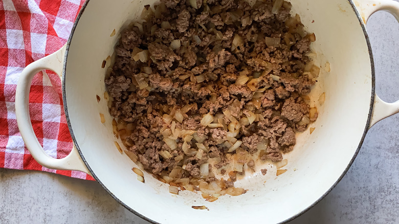 onion and beef in a pan