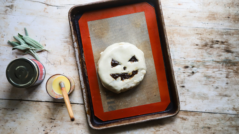 Brushing dough with egg wash