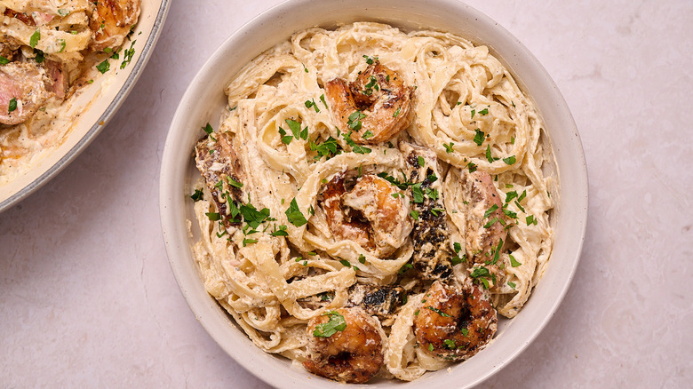 Steak and shrimp Alfredo in bowl