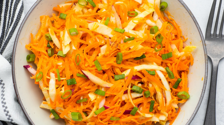 garnished carrot slaw in bowl