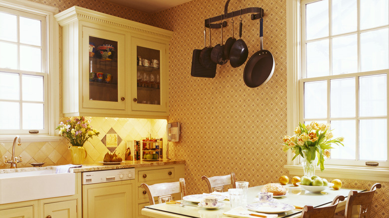 A wallpaper kitchen with a warm color scheme