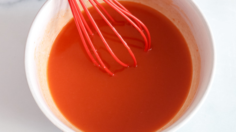 Whisked hot honey in a bowl