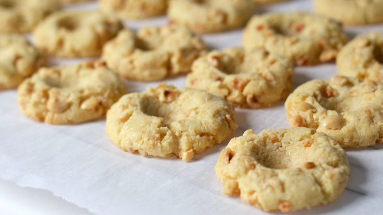 Hazelnut thumbprint cookies cooling on a rack