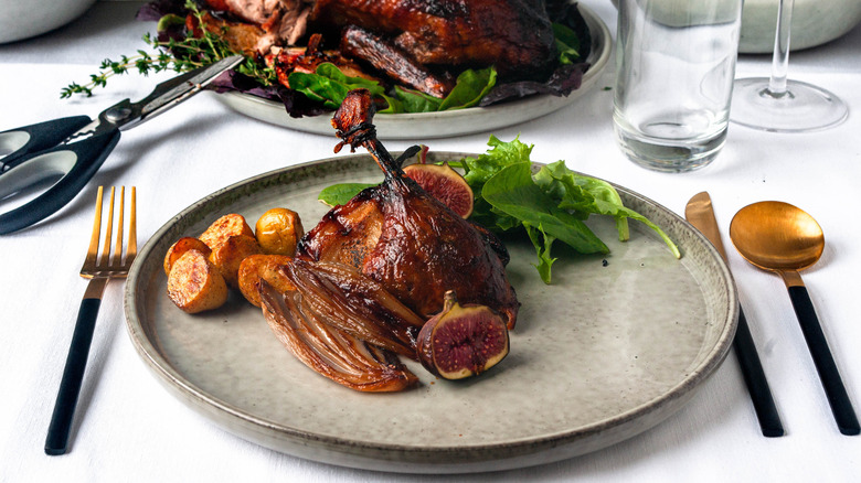 carved roast duck on plate