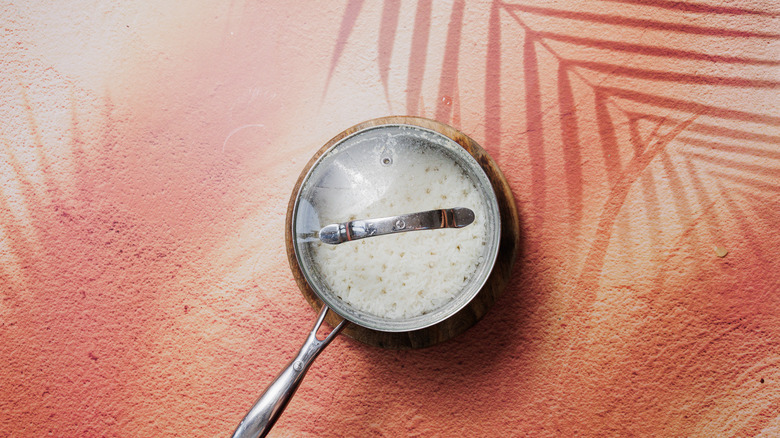 Cooked rice in saucepan