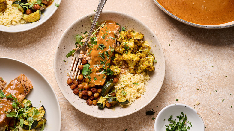 curry salmon grain bowl on table