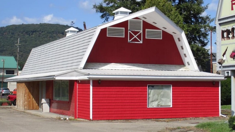 An unmarked former Red Barn Restaurant with fresh red and white paint