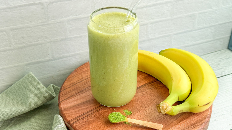 smoothie in glass and bananas