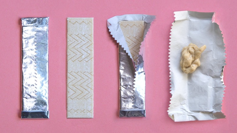 Sticks of gum on pink background