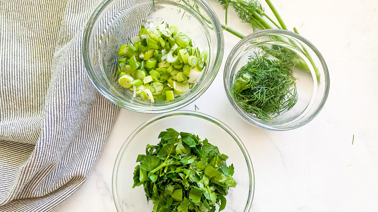parsley, dill, and scallions in bowl