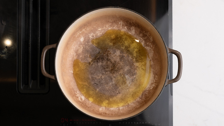 Pot with butter heating on stove