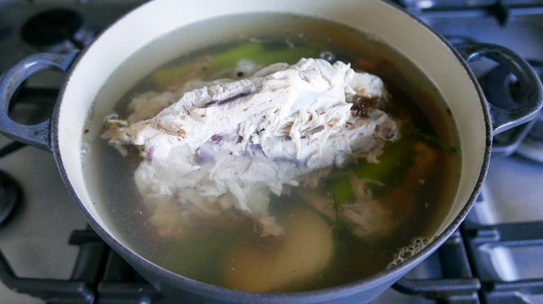 chicken, water, vegetables in pot