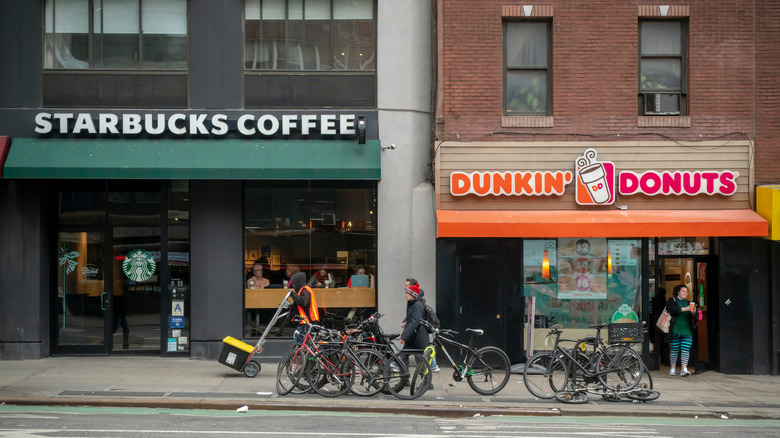 Starbucks and Dunkin' stores next door to one another