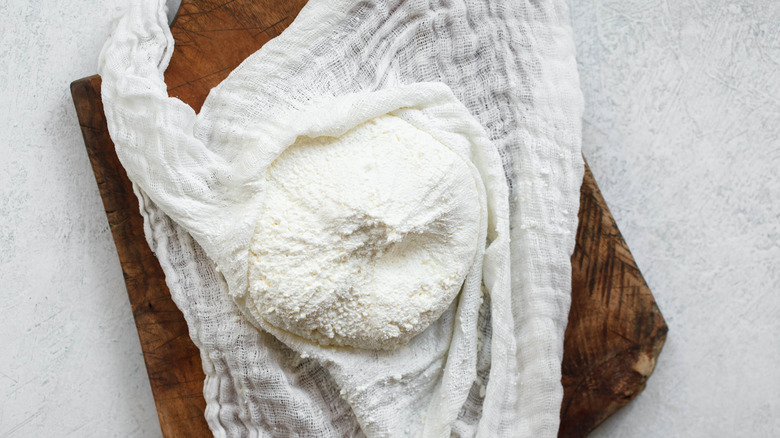 Fresh cheese in cheesecloth