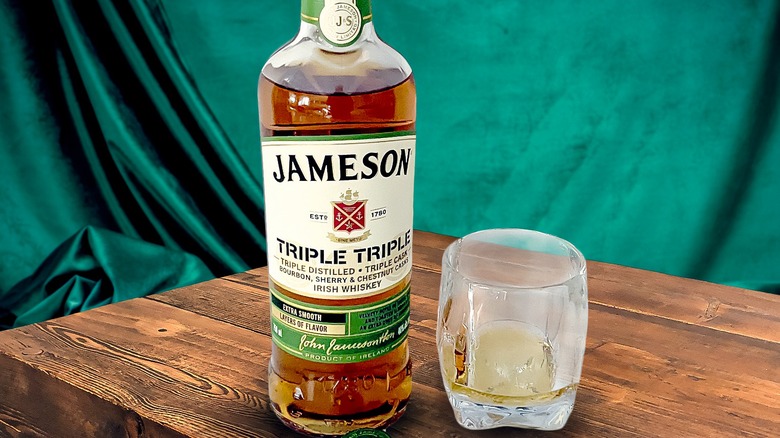 Jameson Triple Triple bottle next to a glass