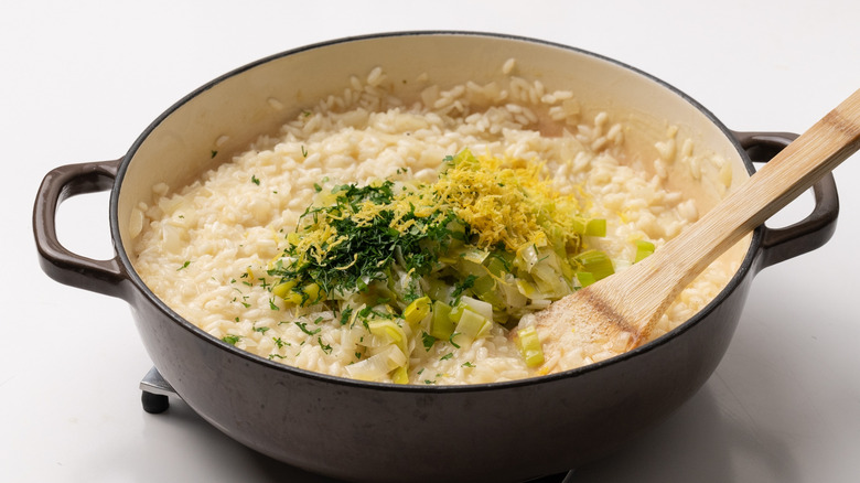 adding final ingredients to risotto