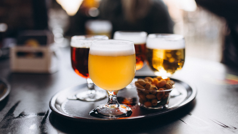 Glasses of beers on tray