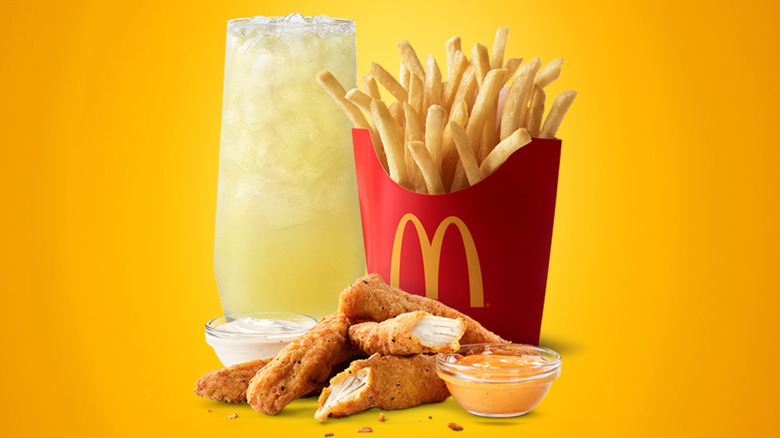 The new McDonald's McCrispy Strips and Creamy Chili Dip beside fries and a drink