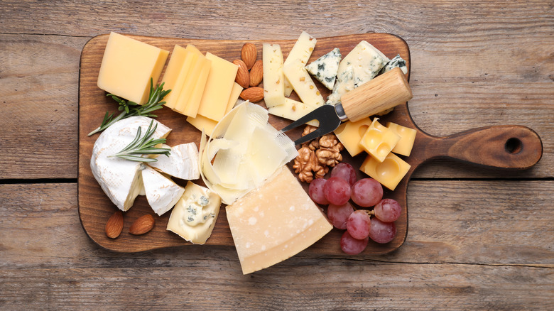 Charcuterie board with cheese almonds grapes