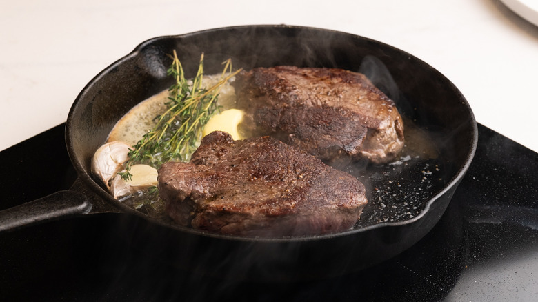 cooking steaks with aromatics