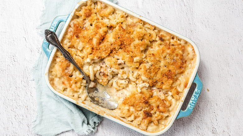 Lobster mac and cheese with one spoonful taken out