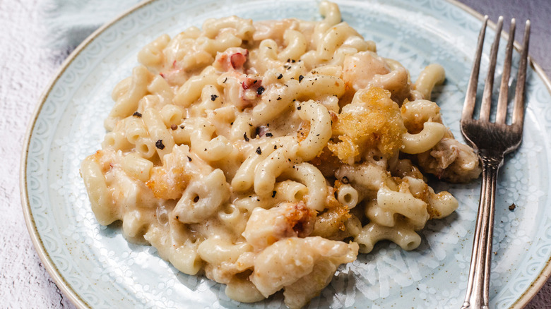 Plate of lobster mac and cheese with fork