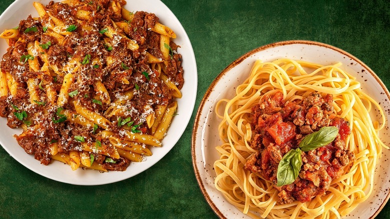 Overview of pasta alla Genovese and pasta Bolognese on a green surface