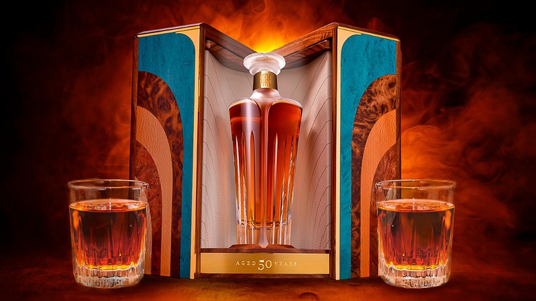 Box and bottle of Midleton Very Rare Silent Distillery Chapter Six between two glasses