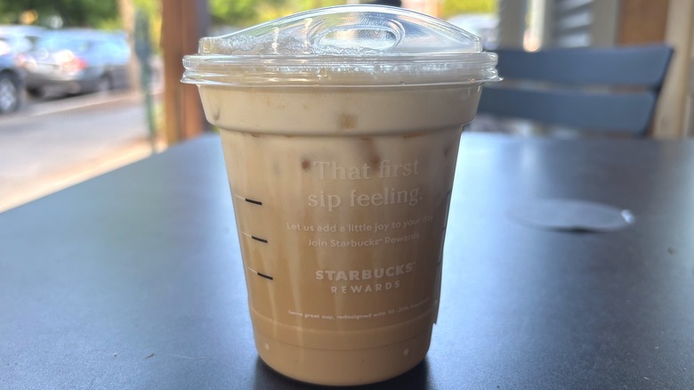 Starbucks iced latte with Brown Sugar Cream Cold Foam on table