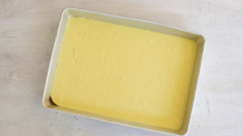 cake batter in greased pan