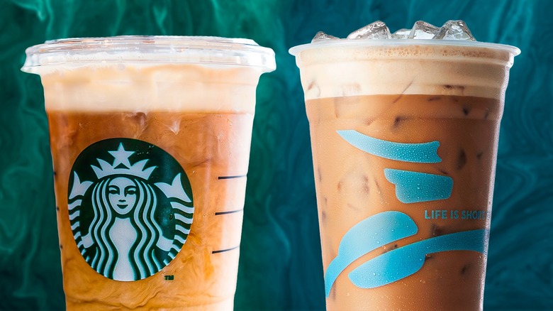 Starbucks and Caribou lattes in plastic cups side by side