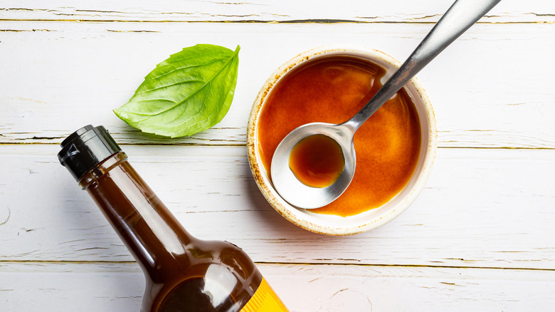 Worcestershire sauce in a bowl and a bottle