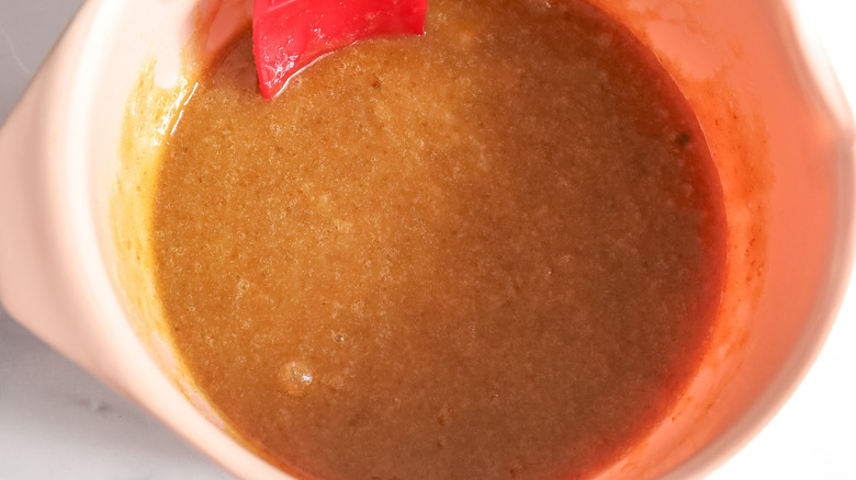 light brown batter in pinkish bowl