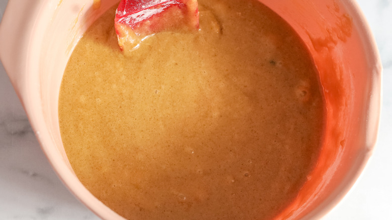 light brown batter in pinkish bowl